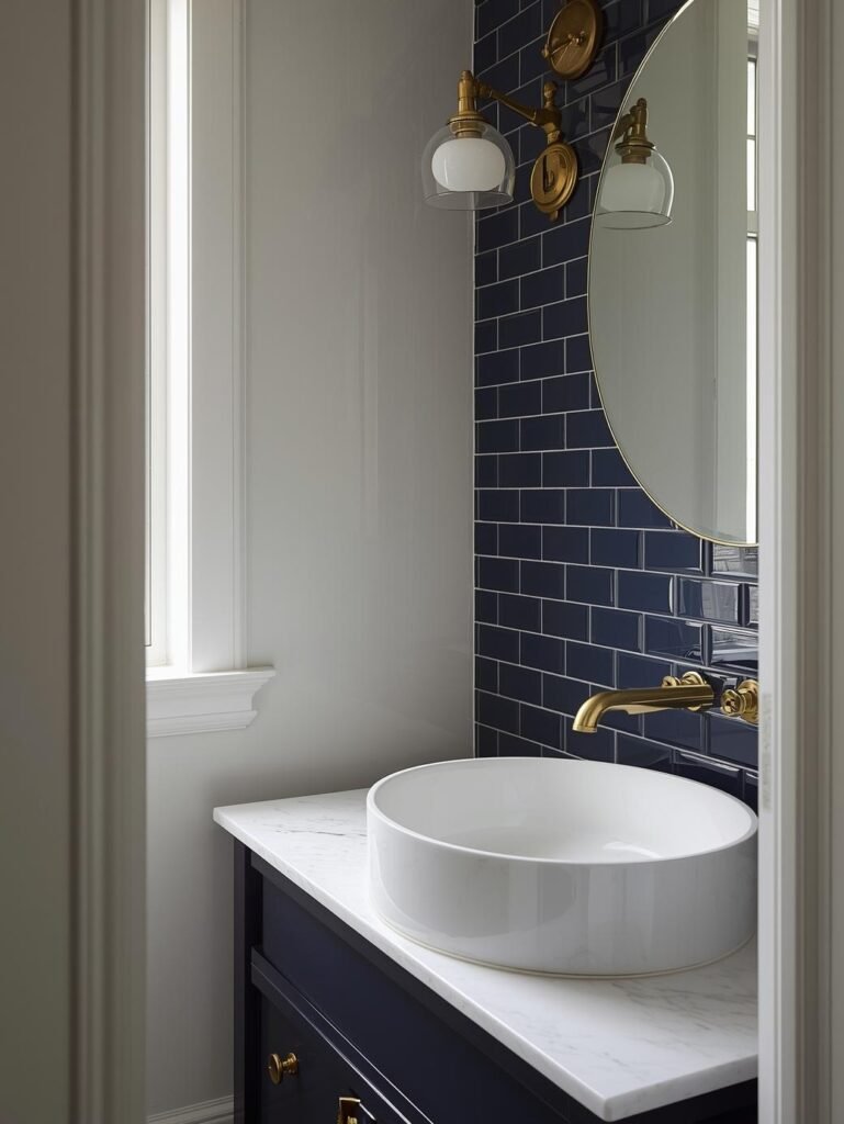 Navy tiles and brass accents create a sophisticated bathroom color scheme.